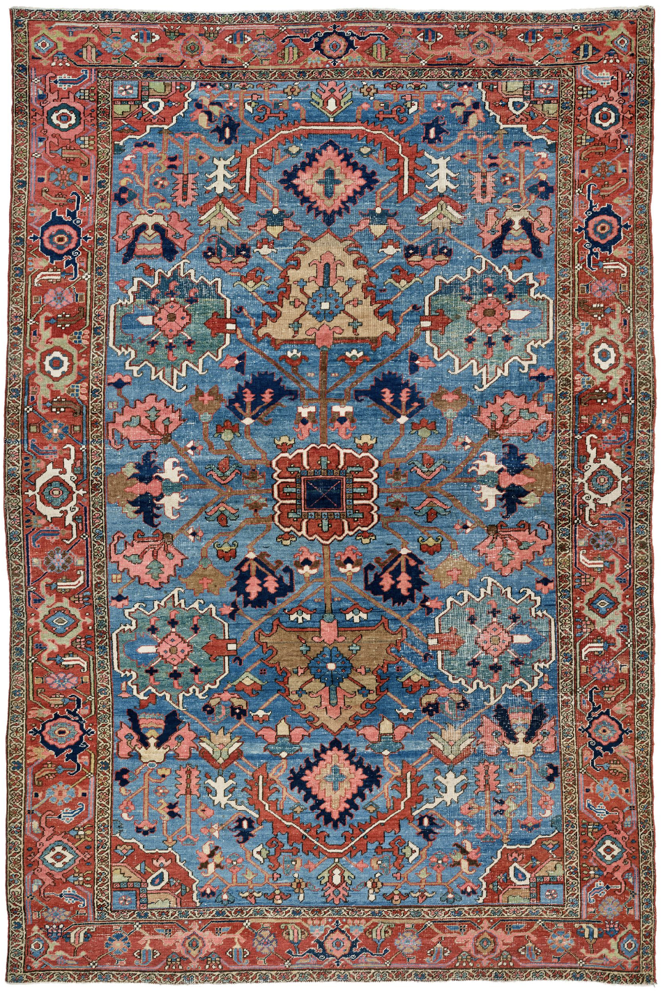 A blue and red rug with a floral pattern on it.
