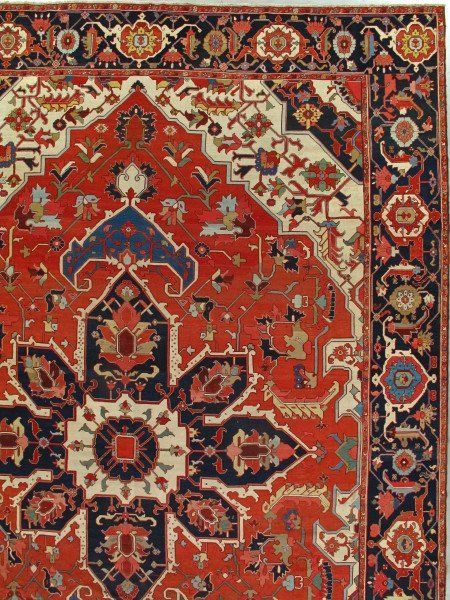 A close up of a rug with a floral pattern