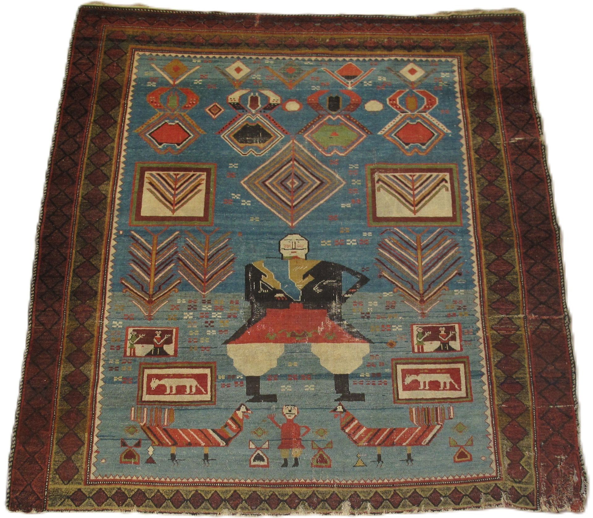 A rug with a man riding a horse on it