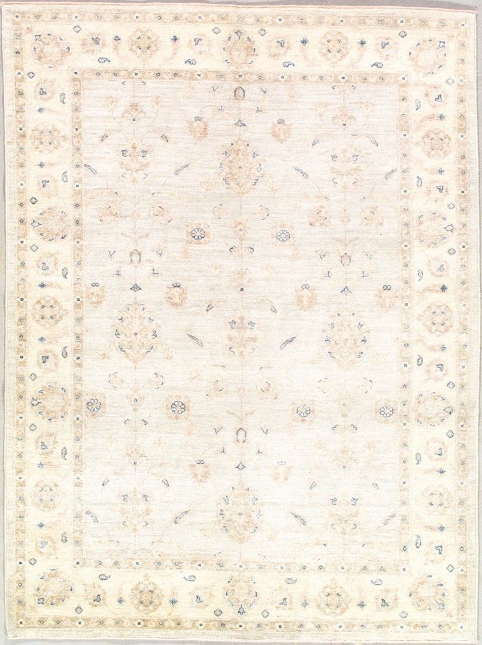A white rug with a floral pattern on it