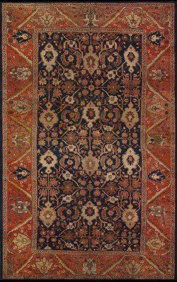 A close up of a rug with a floral pattern on it.