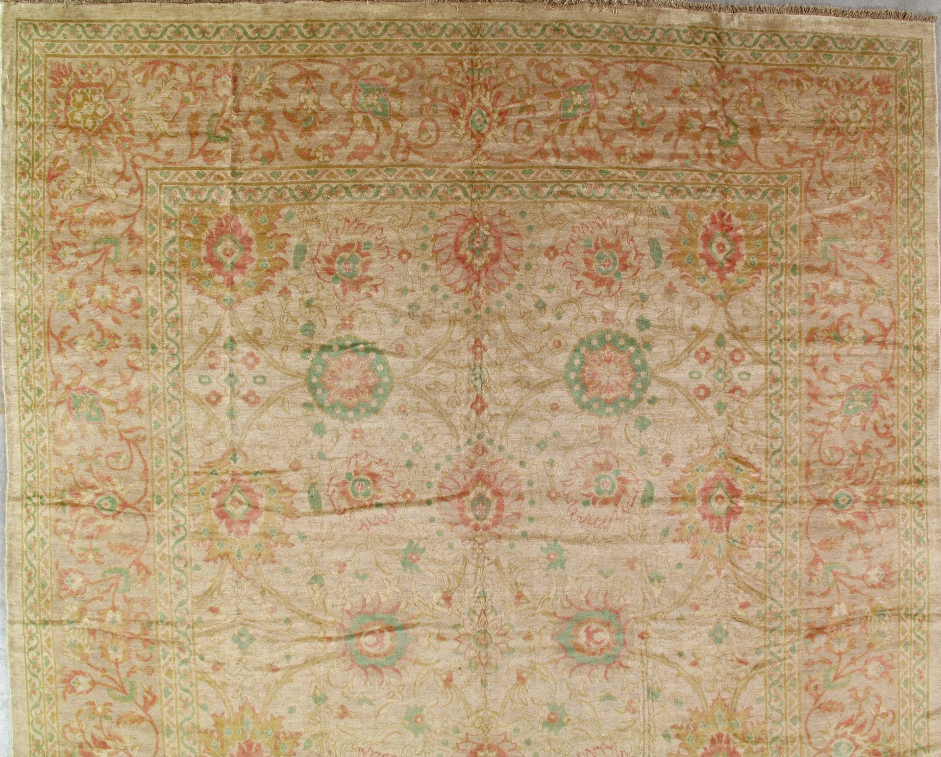 A rug with a floral pattern on it is sitting on a table.