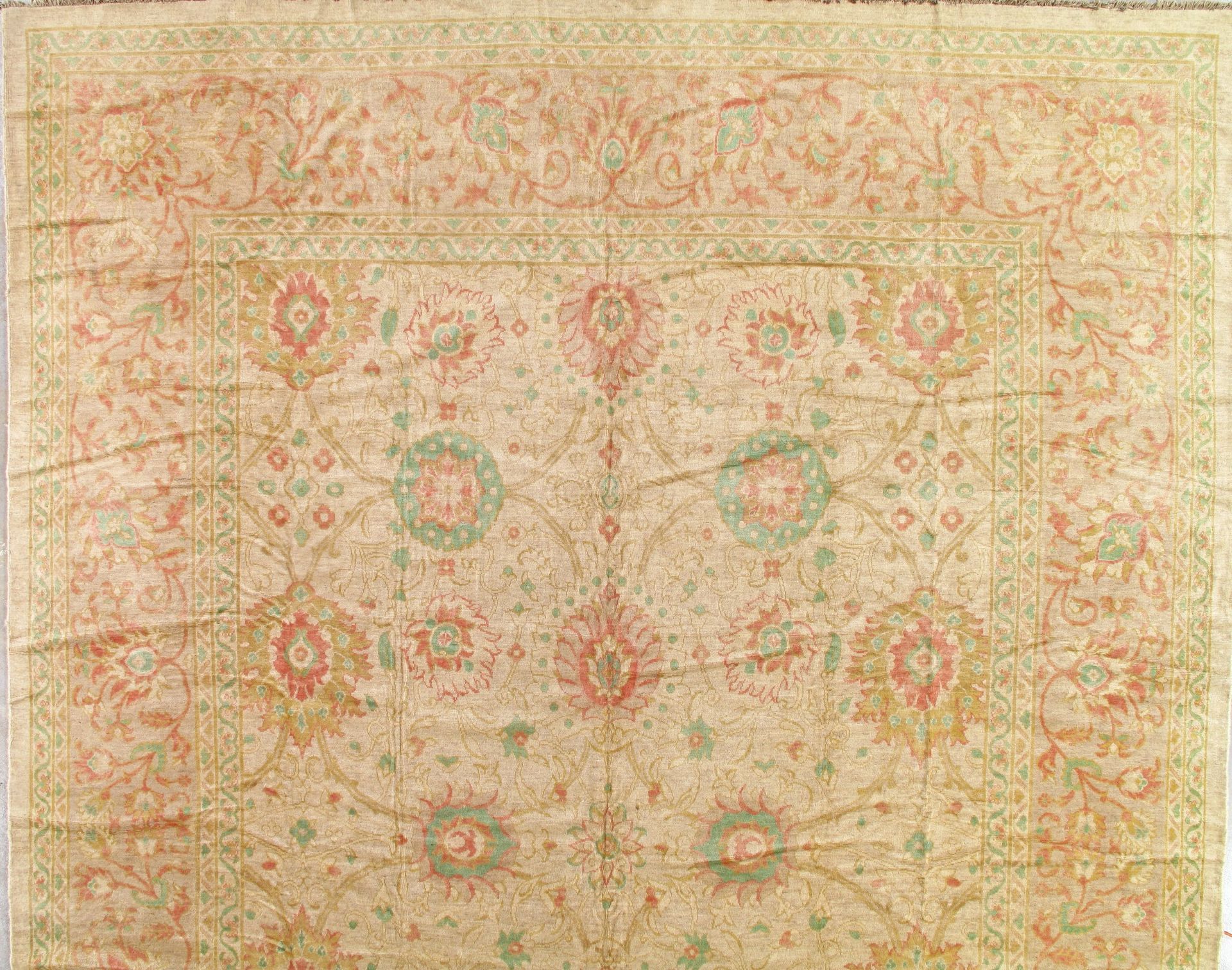 A rug with a floral pattern on it is sitting on a table.