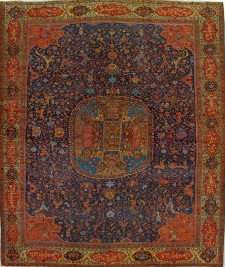 A rug with a coat of arms on it is hanging on a wall.