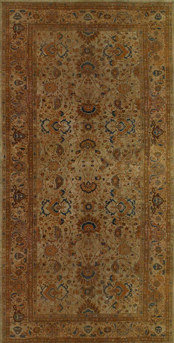 A rug with a floral pattern on it is on a white background.