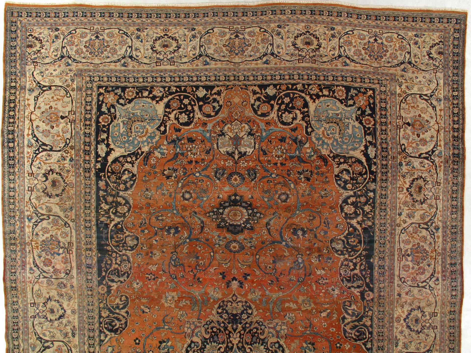 A rug with a floral pattern on it is on a white background