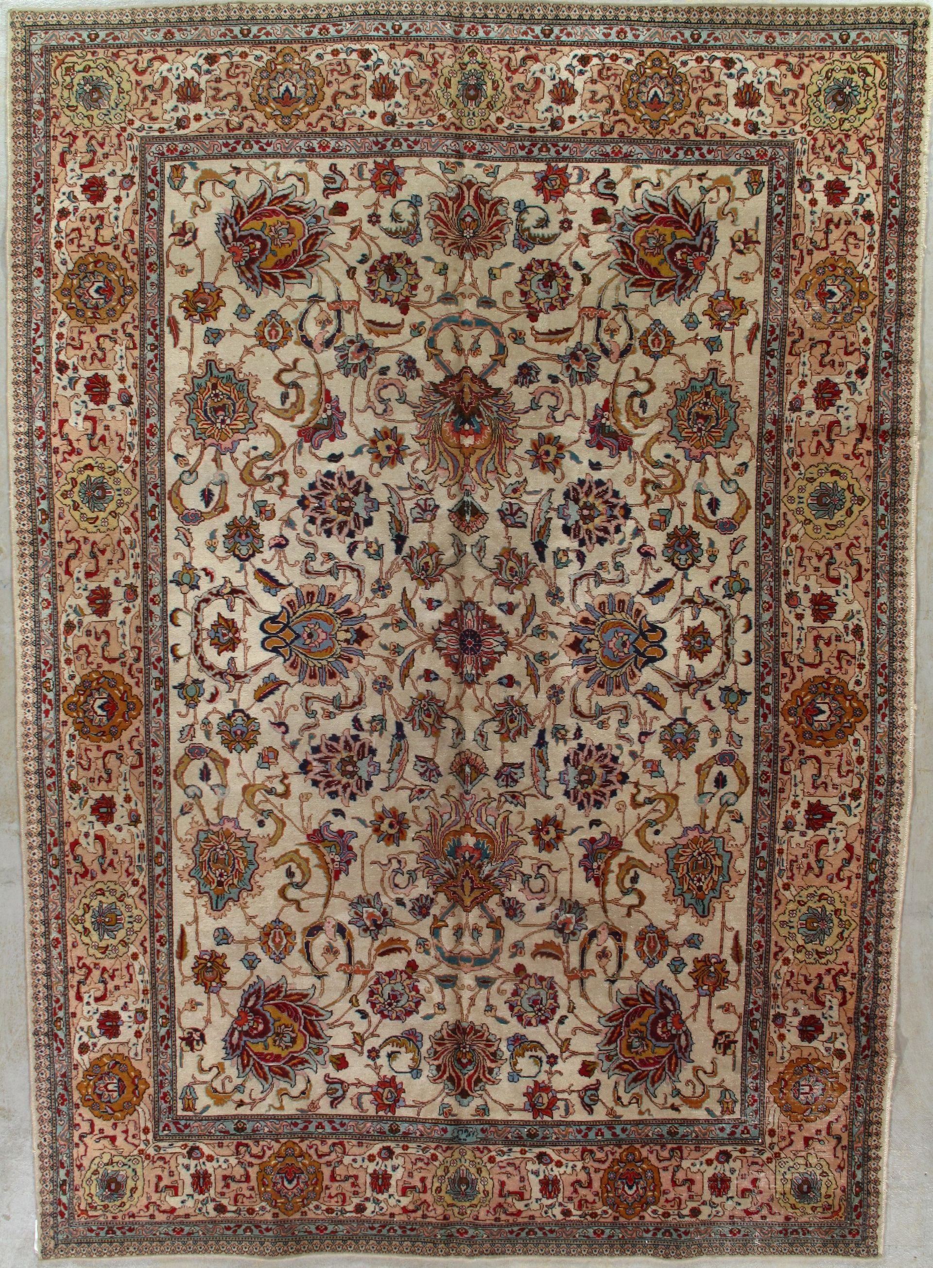 A rug with a floral pattern on it is sitting on a table.