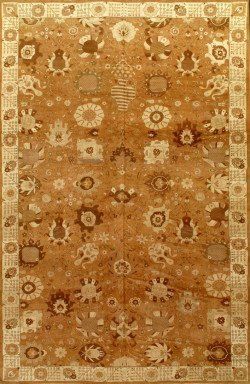 A rug with a pattern of flowers and circles on it