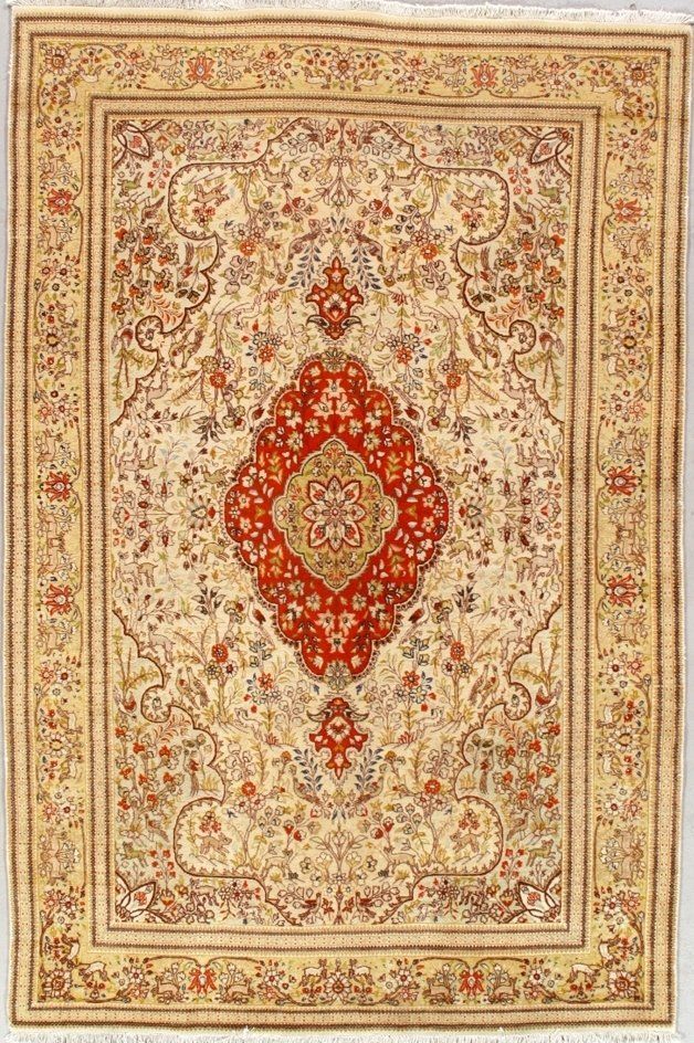 A rug with a floral pattern on it is on a white surface.