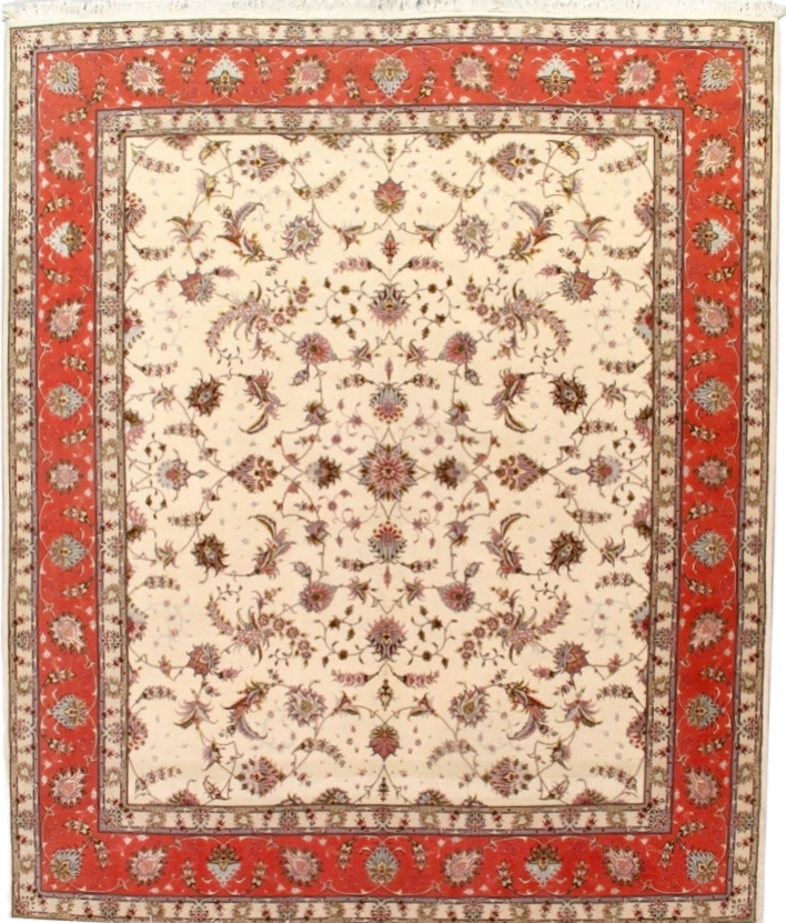 A rug with a floral pattern and a red border