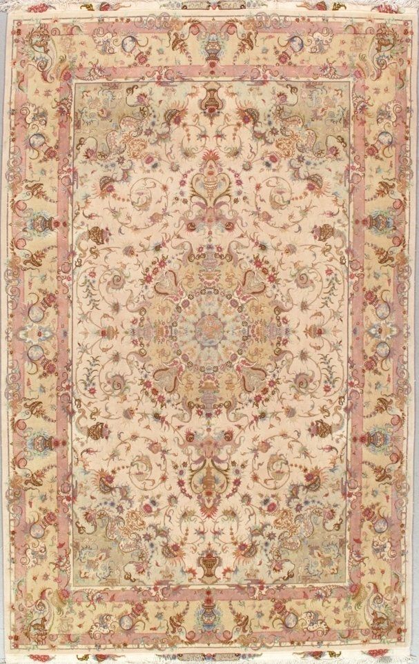 A rug with a floral pattern on it is on a white surface.