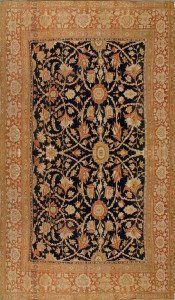 A rug with a floral pattern on it is sitting on a table.