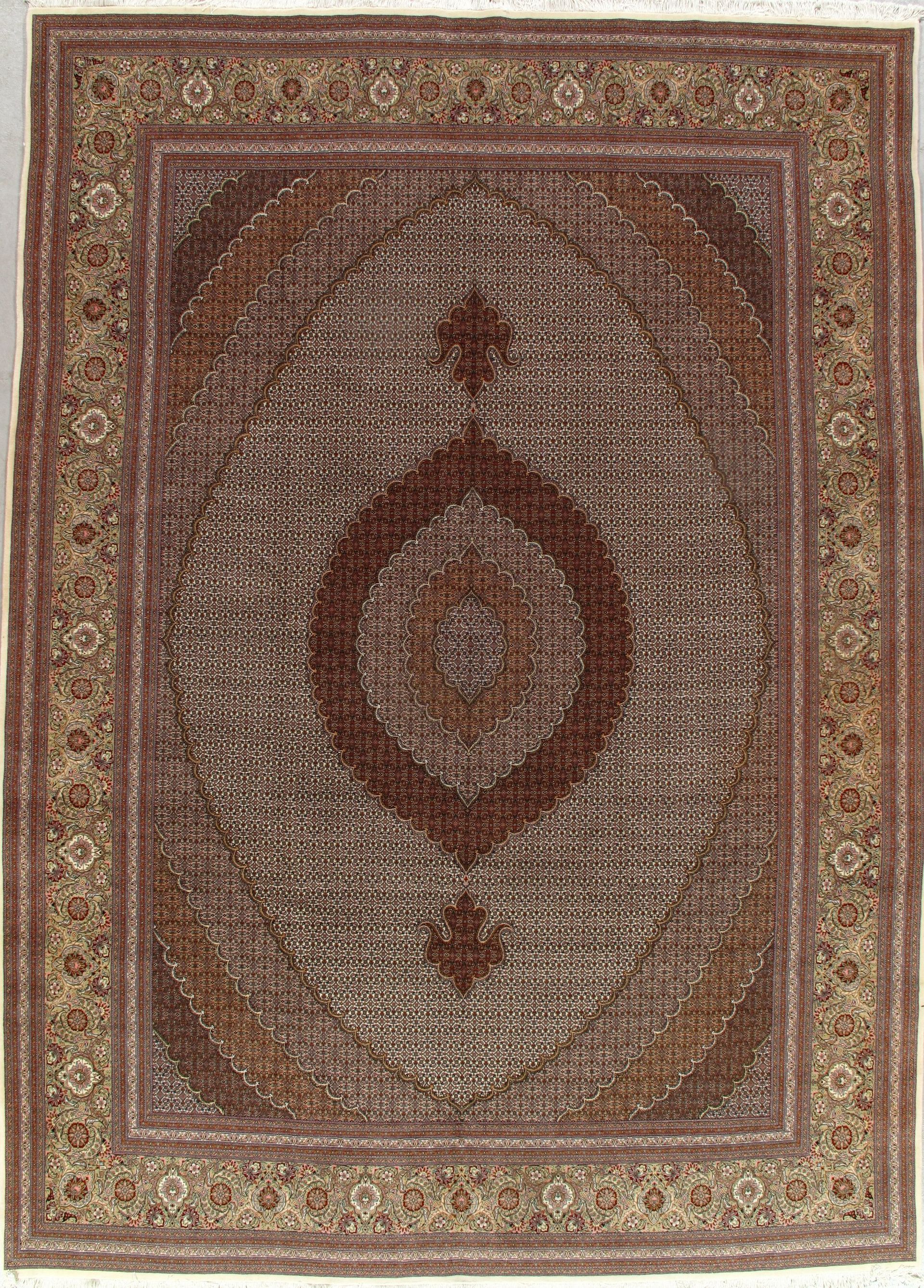 A rug with a pattern on it is hanging on a wall.
