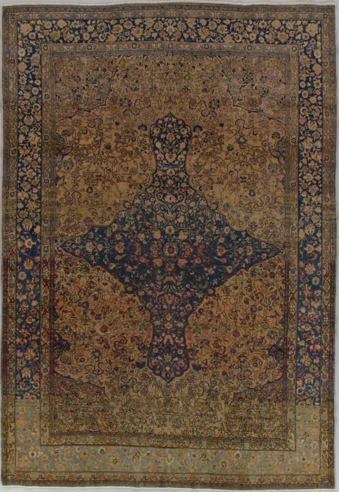 A rug with a floral pattern on it is sitting on a table.