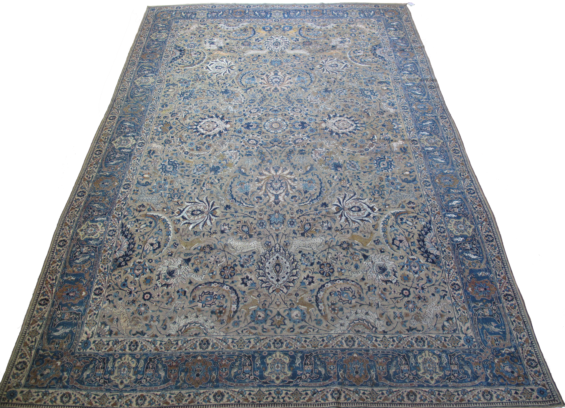 A rug with a pattern on it is sitting on a white surface.
