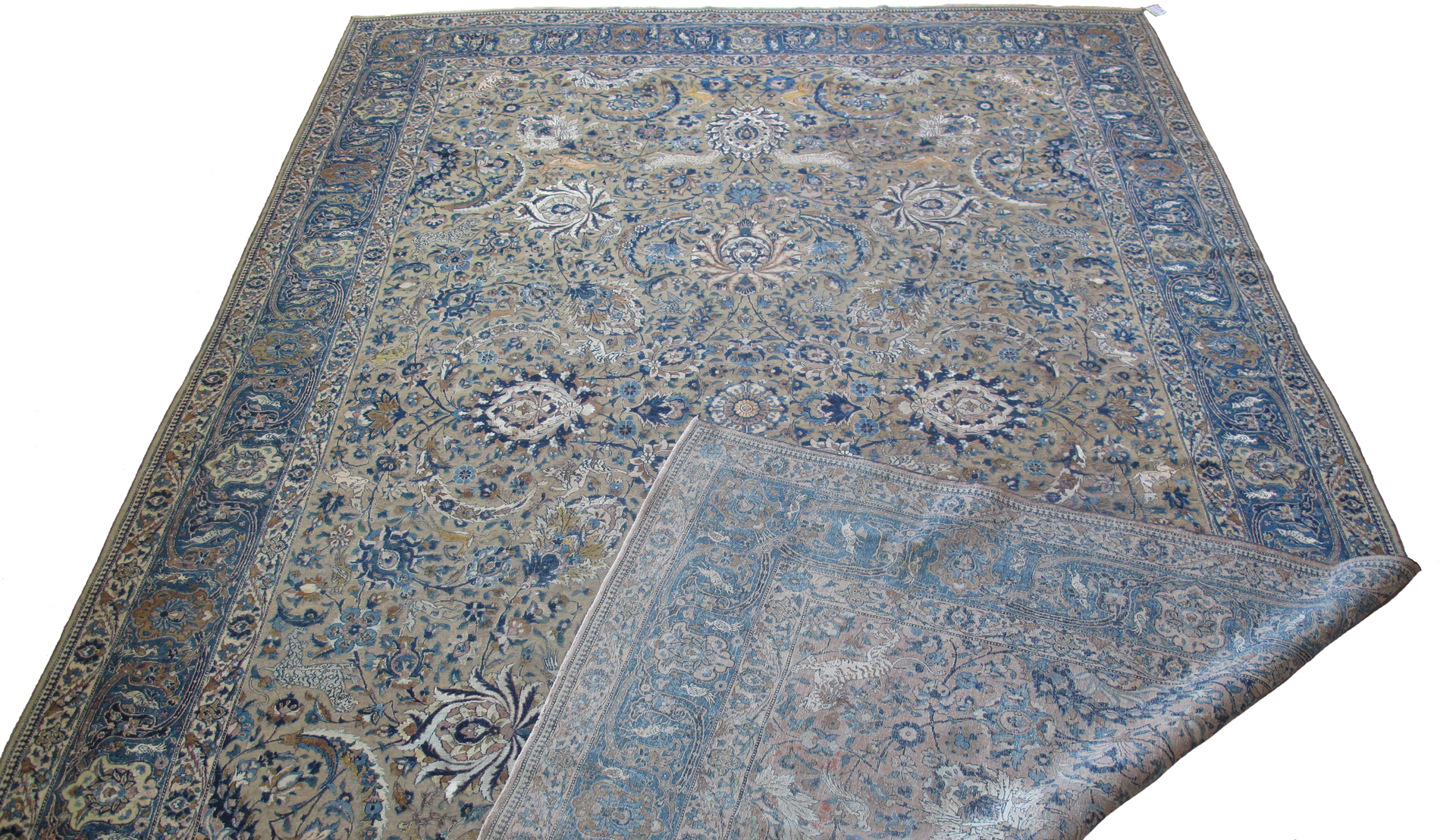 A rug with a pattern on it is sitting on a white surface.