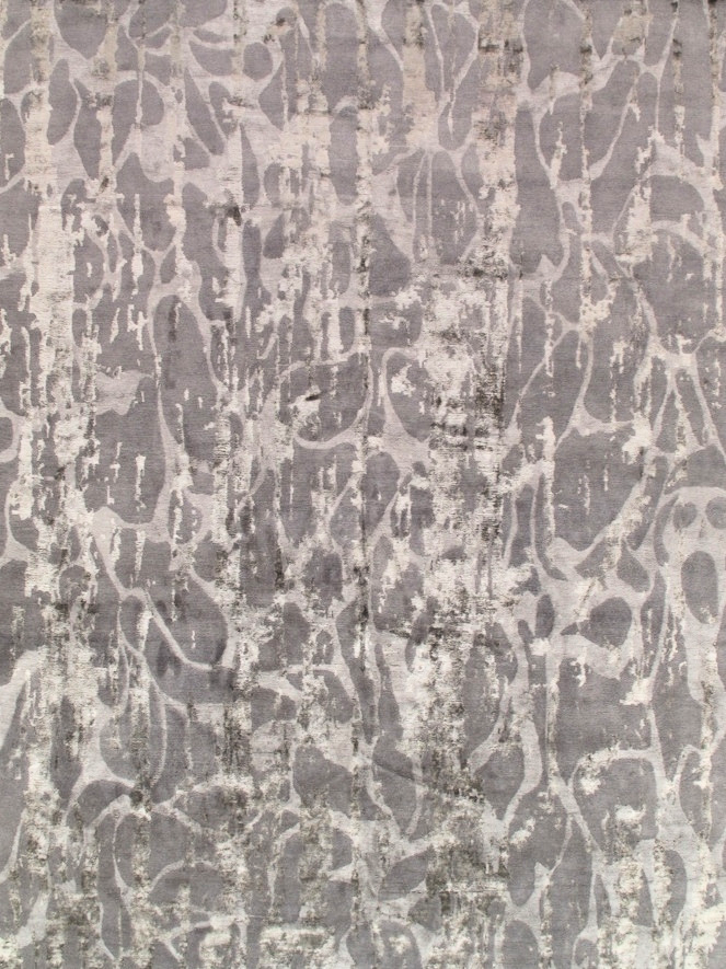 A close up of a rug with a pattern on it.