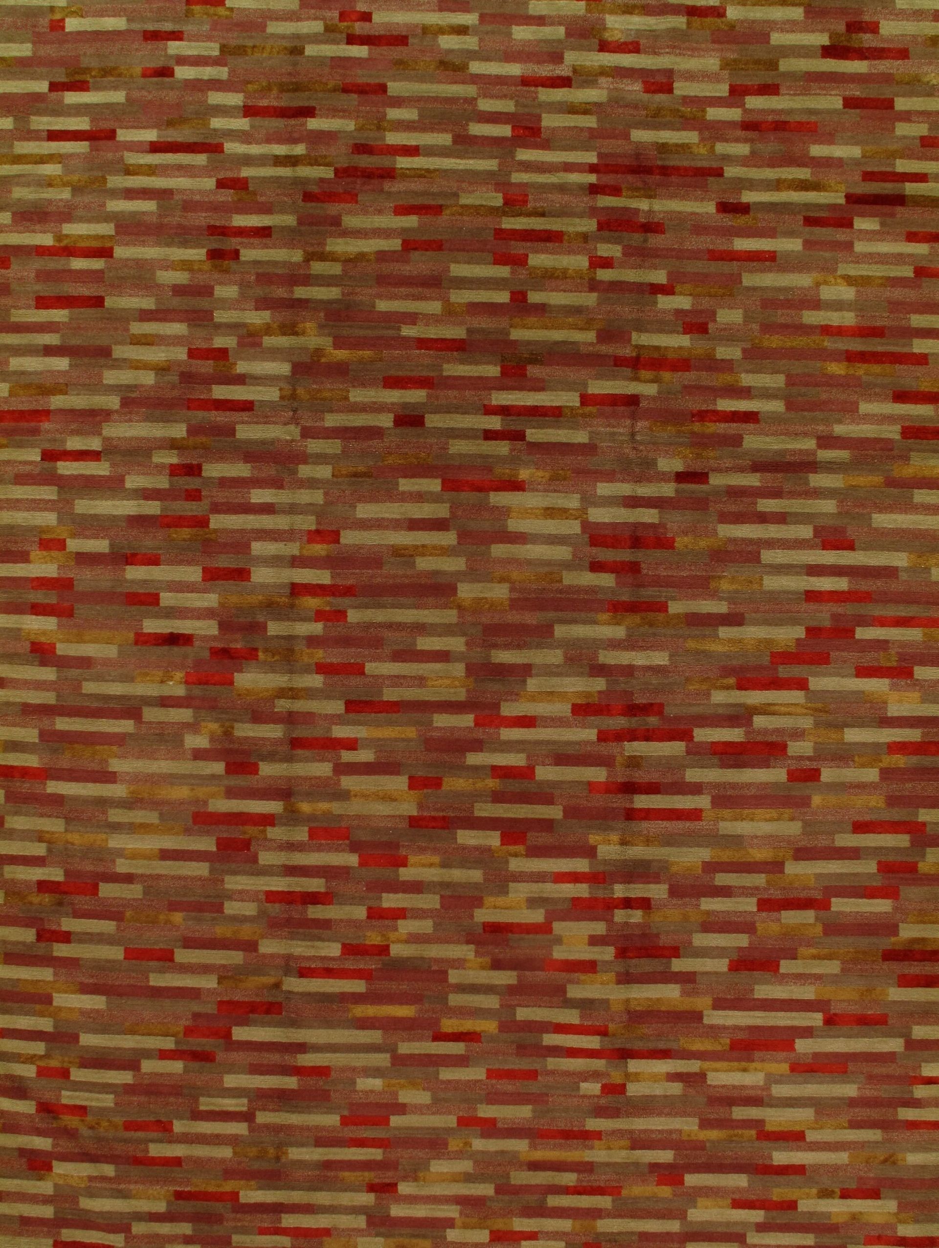 A close up of a red and yellow rug with a brick pattern.