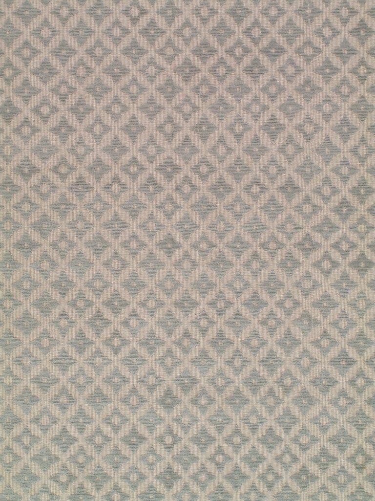 A close up of a rug with a pattern on it.