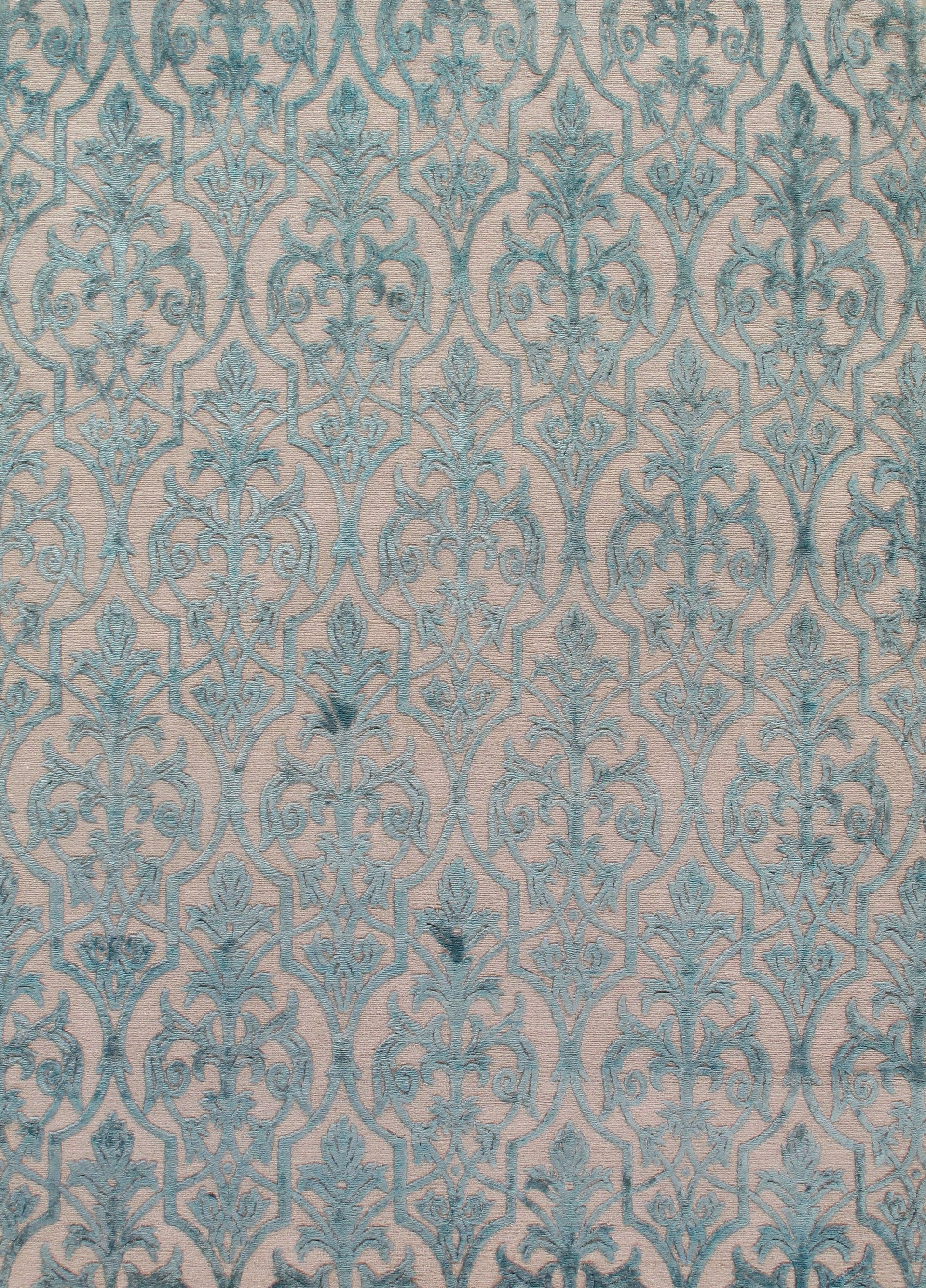 A close up of a blue and white rug with a pattern on it.