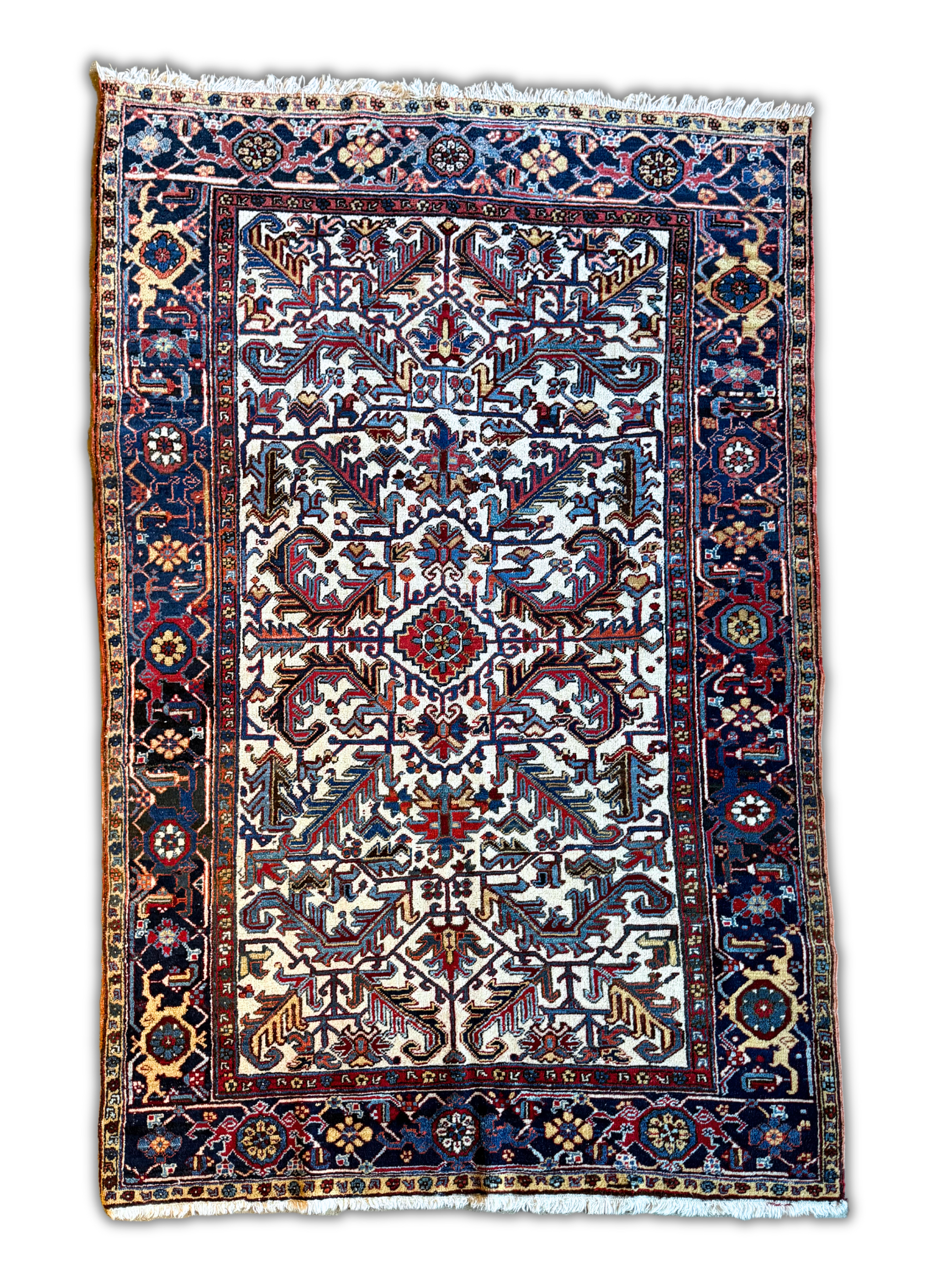 A rug with a floral pattern is sitting on a white surface.