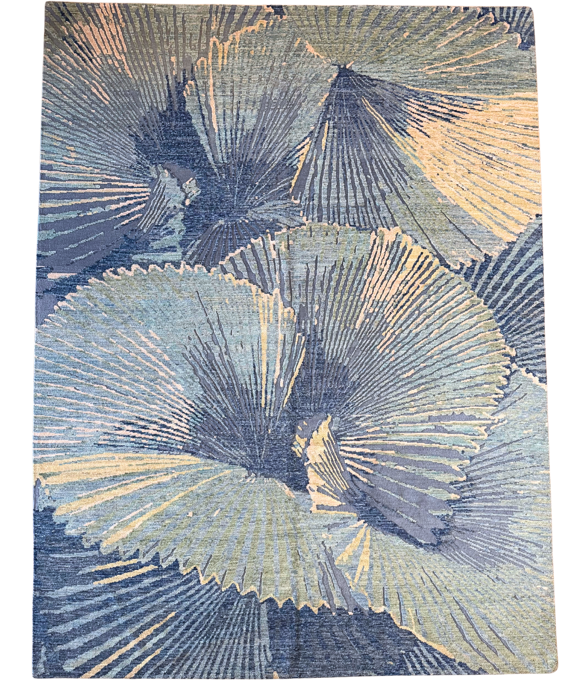 A blue and white rug with a floral pattern on it.