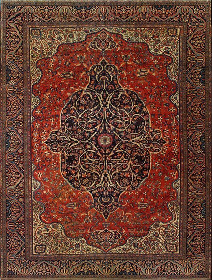 A red and gold rug with a floral pattern on it
