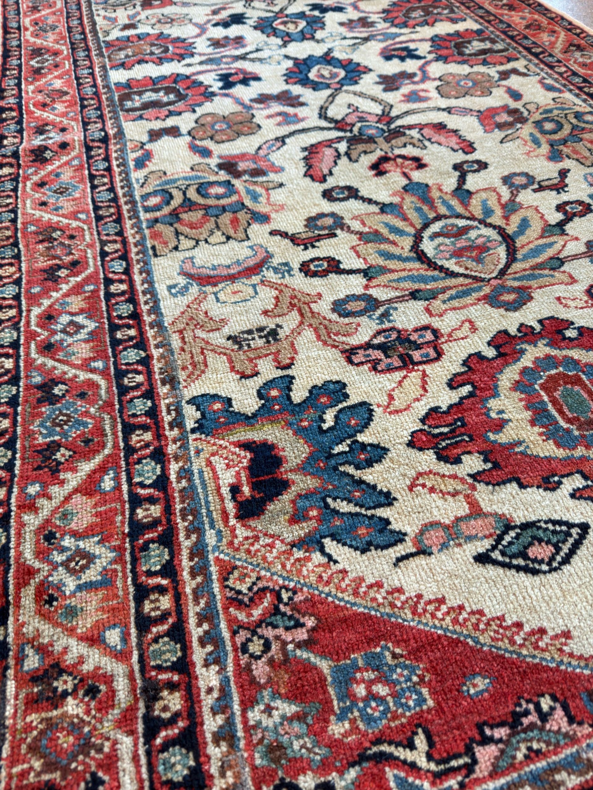 A rug with a floral pattern on it is on a white background.