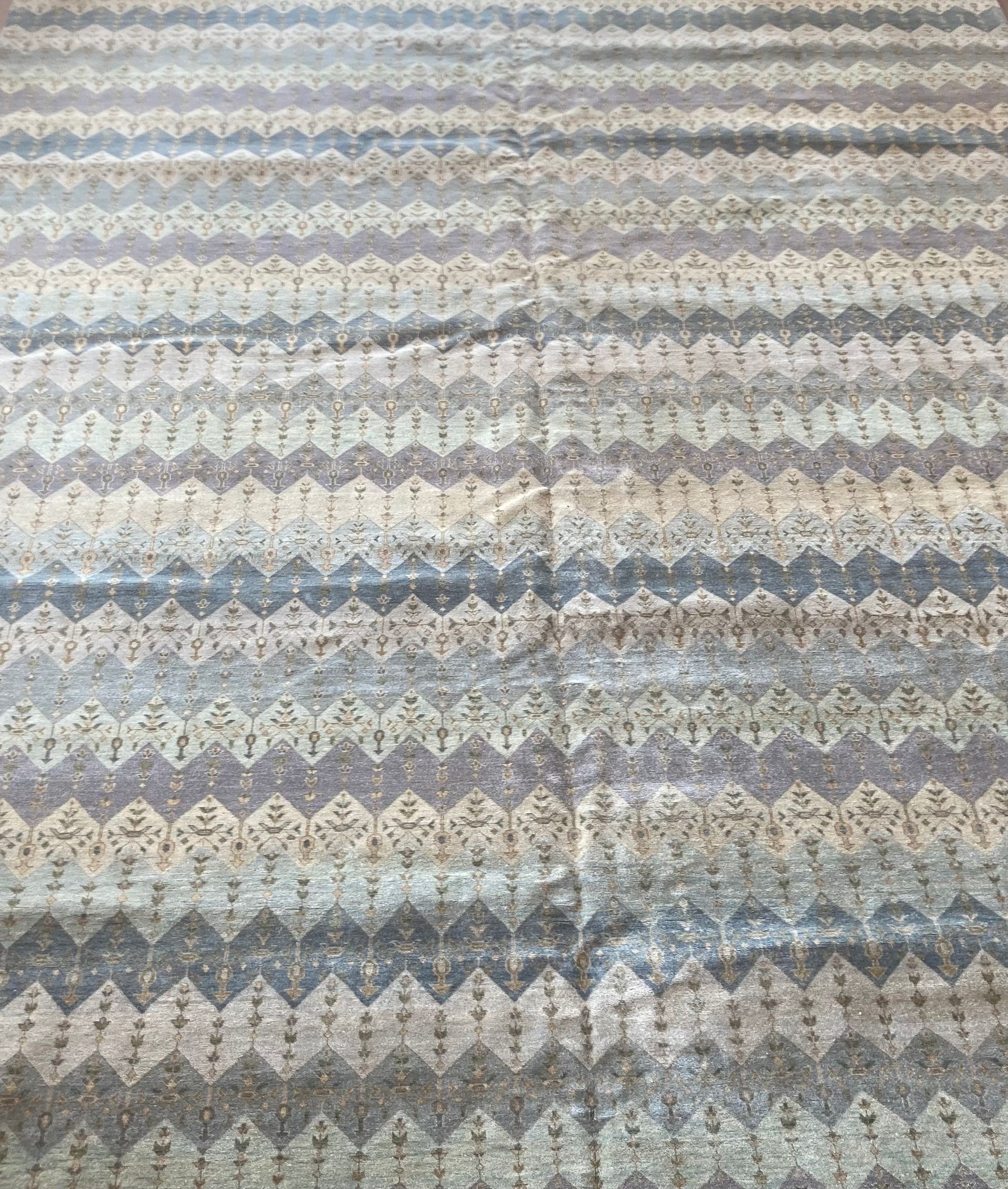 A rug with a pattern on it is on a white background.