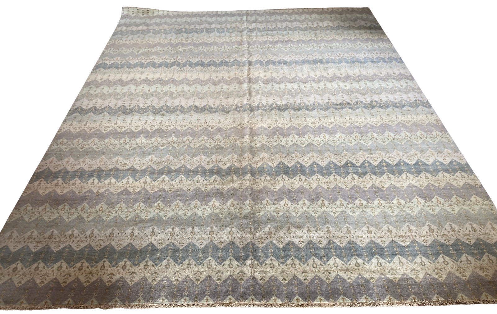 A rug with a pattern on it is on a white background.