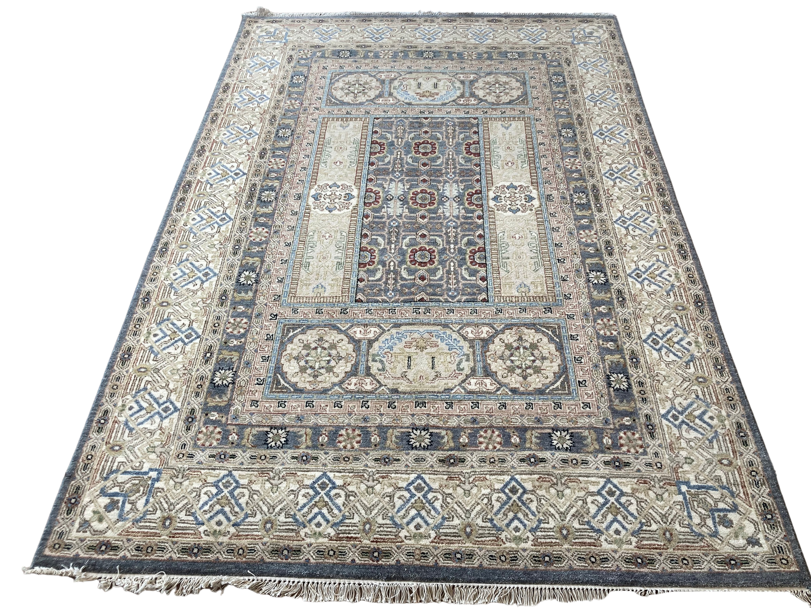 A rug with a pattern on it is on a white background.