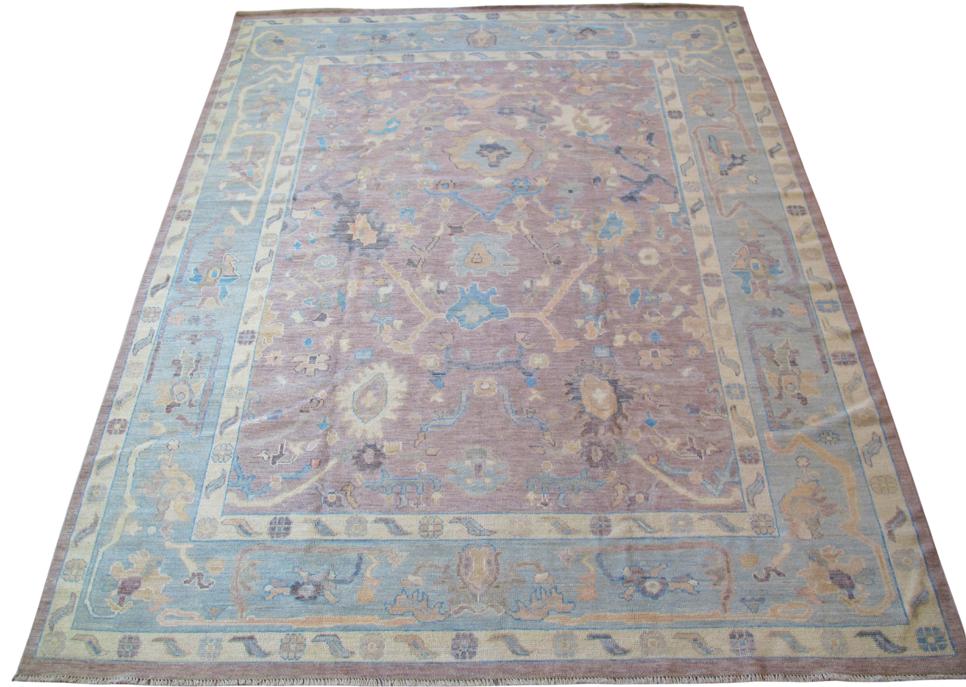 A rug with a floral pattern on it is on a white background.