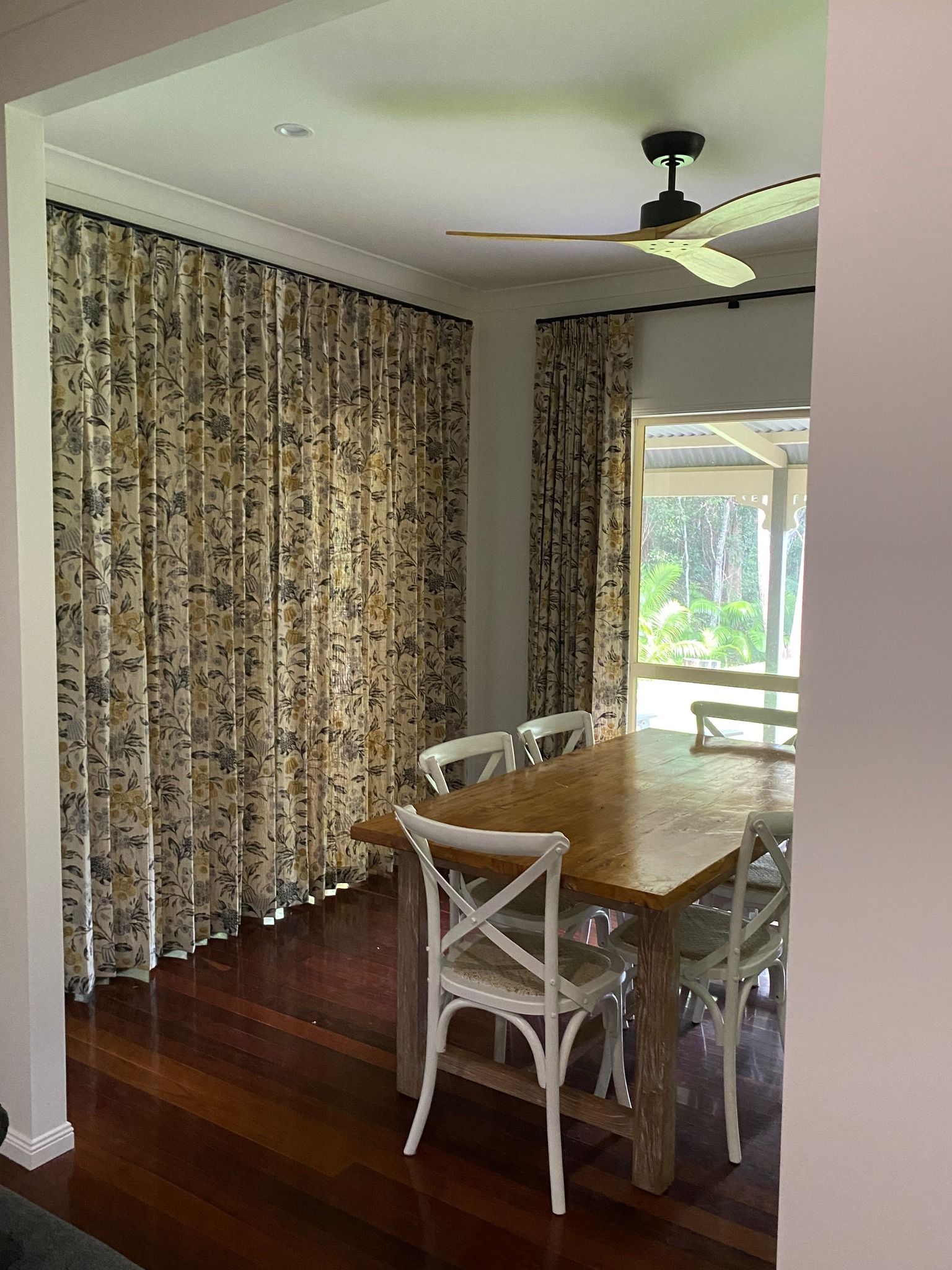 A Living Room with A Couch , Table , and A Painting on The Wall — Curtain Concepts in Dunbible, NSW