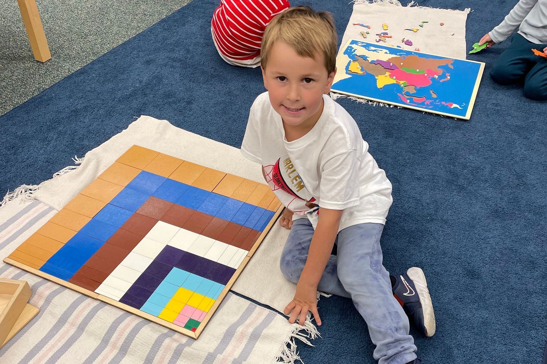 Montessori child working with the Pythagoras square.