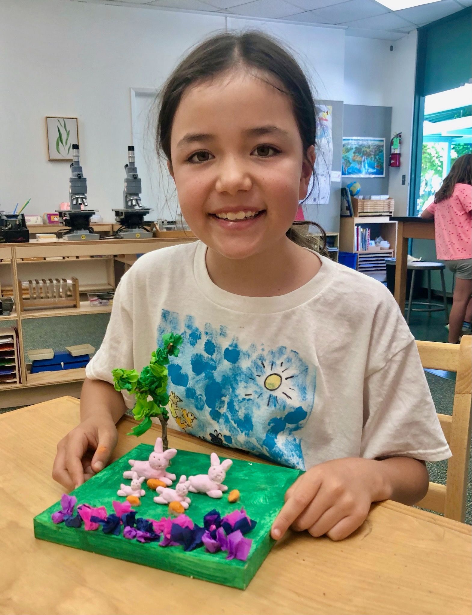 Montessori child working on a craft.