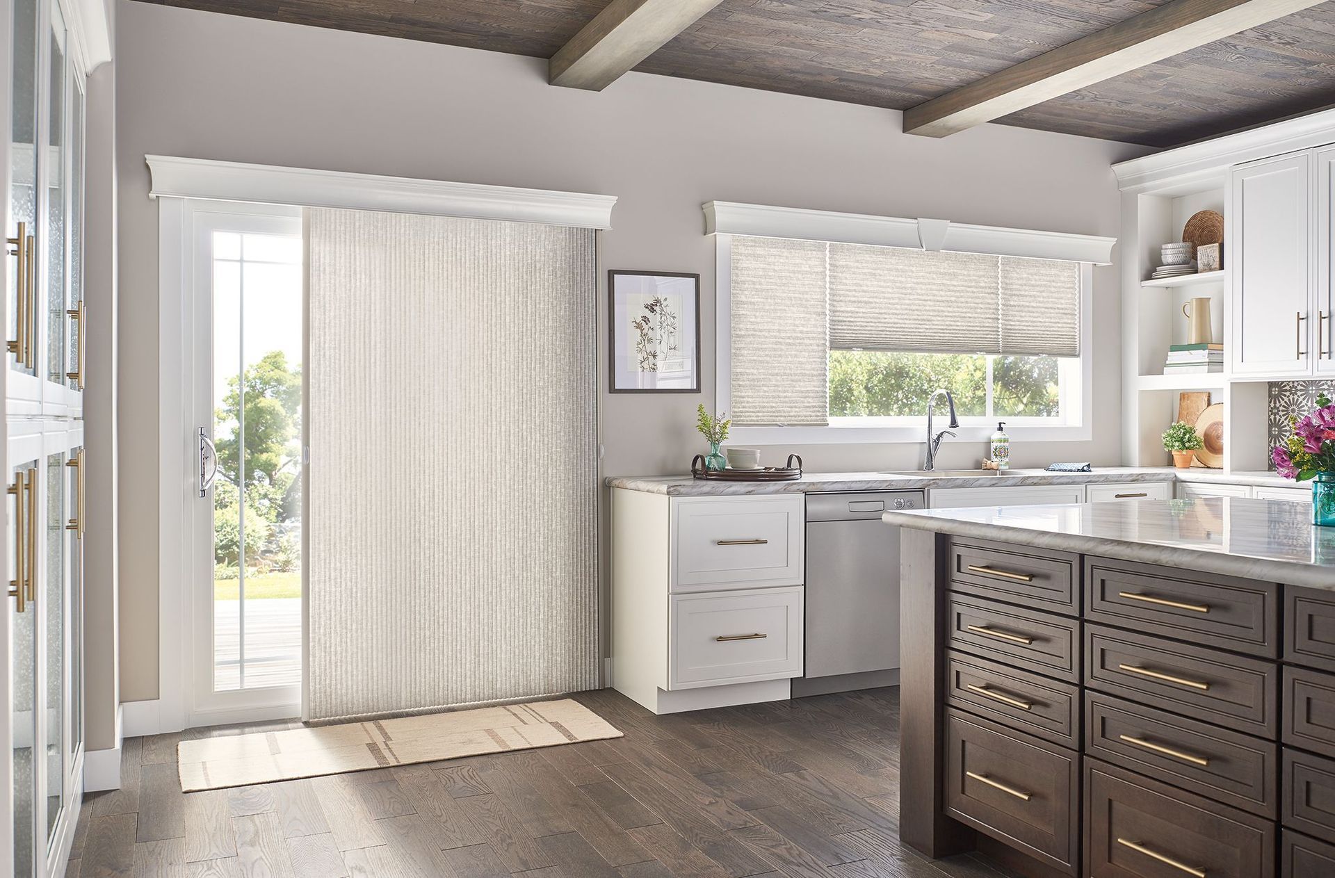 Kitchen with sliding glass door and window, featuring blinds. Dark wood cabinets with white countertops.