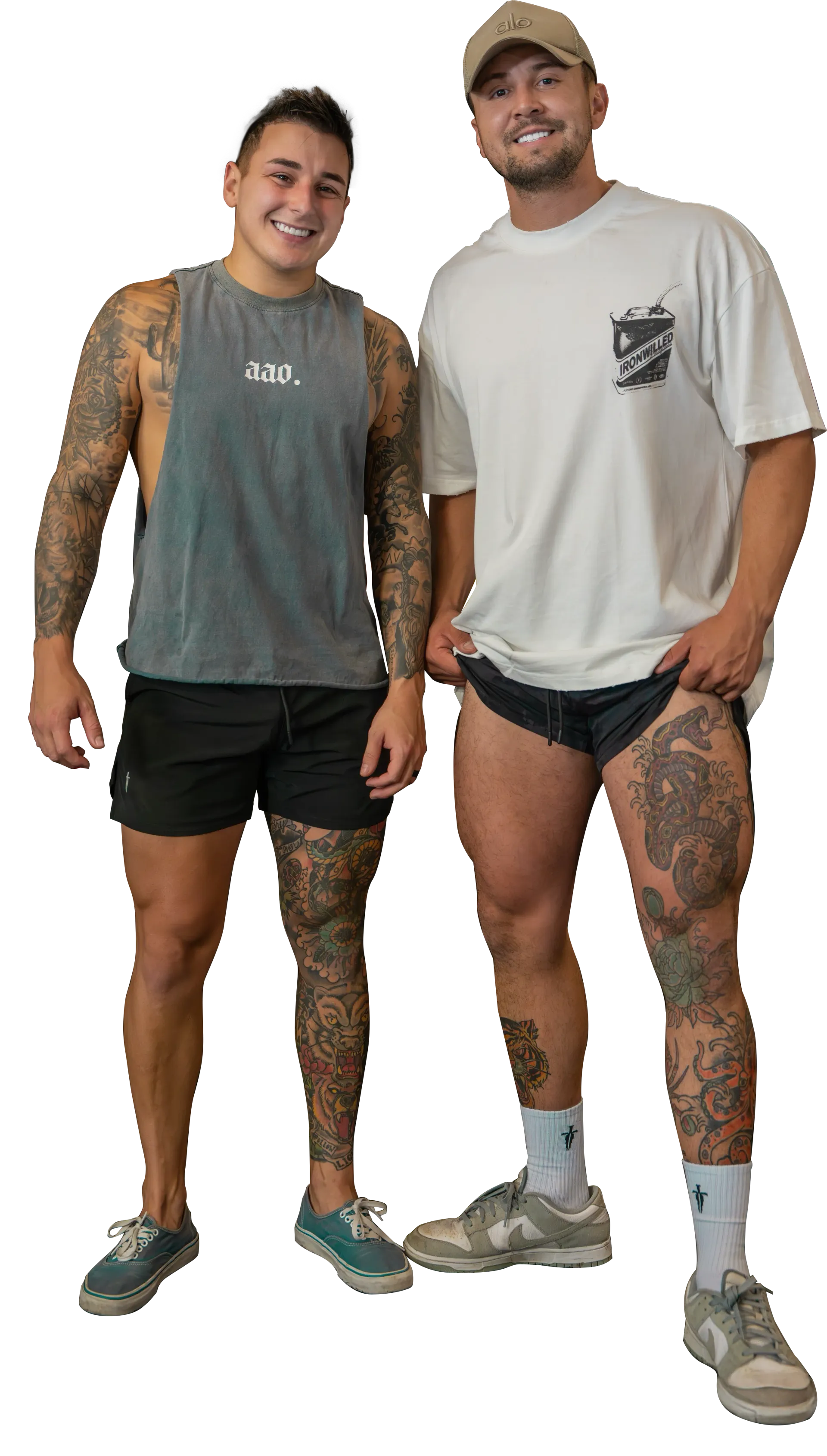 A very muscular man is standing with his hands on his hips.