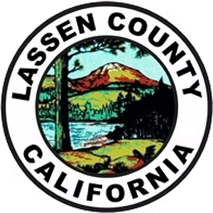 Official seal of Lassen County, California, featuring a lake, trees, and a mountain peak within a circular border.