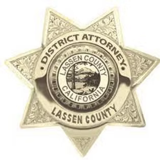 A gold six-pointed star badge for the Lassen County District Attorney in California.