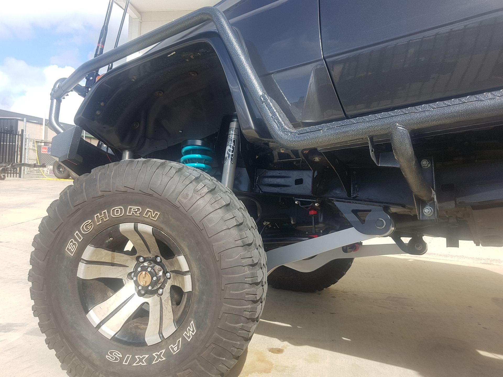 A Lifted Truck's Black Wheel — Ironhide Customs In Garbutt, QLD