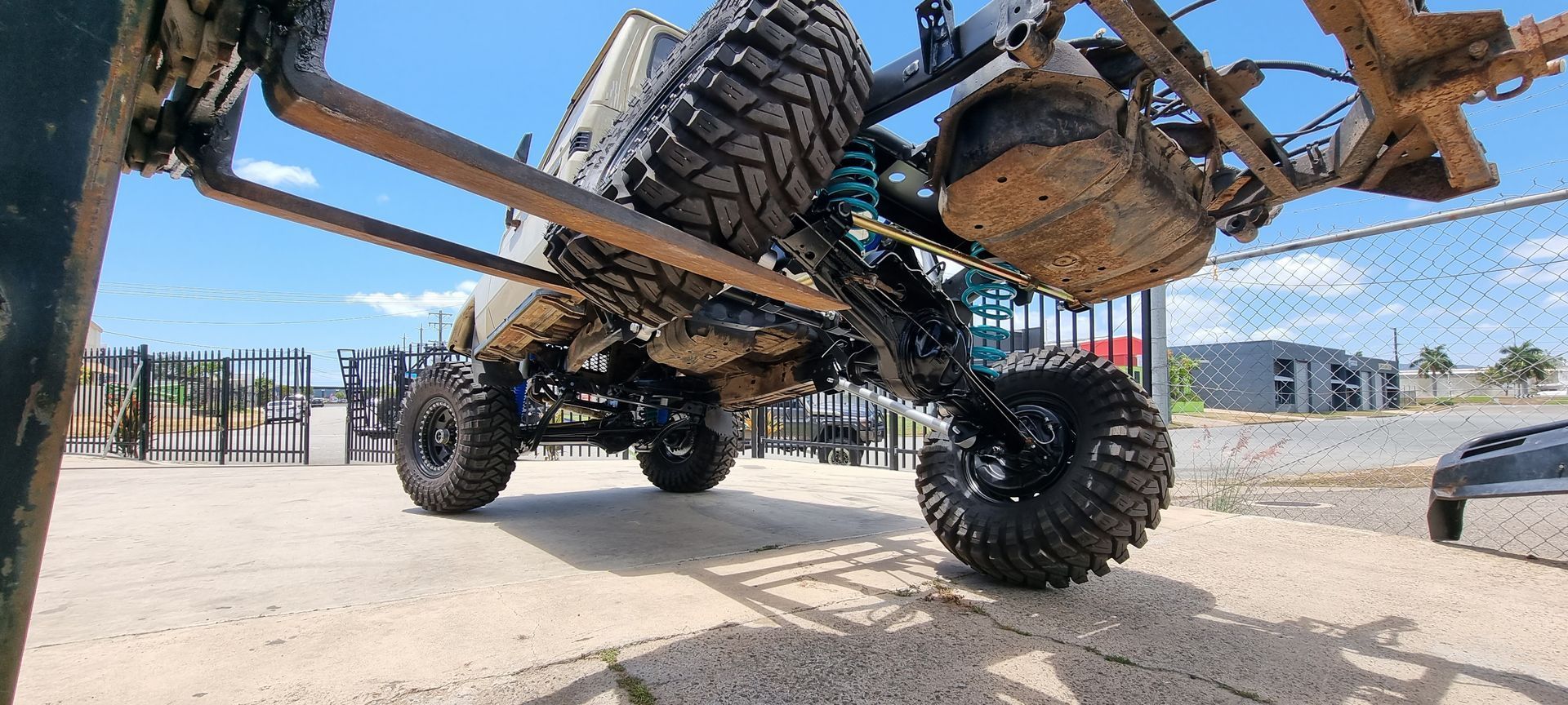 A Vehicle's Undercarriage Showing Turquoise Coil — Ironhide Customs In Garbutt, QLD