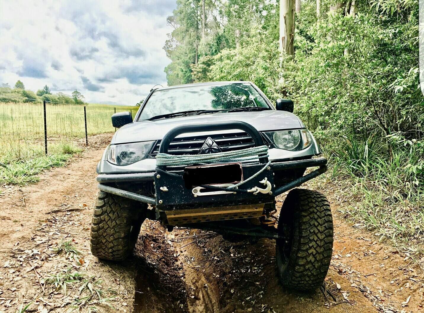 Damaged Off-road Truck on a Muddy Dirt Road — Ironhide Customs In Garbutt, QLD