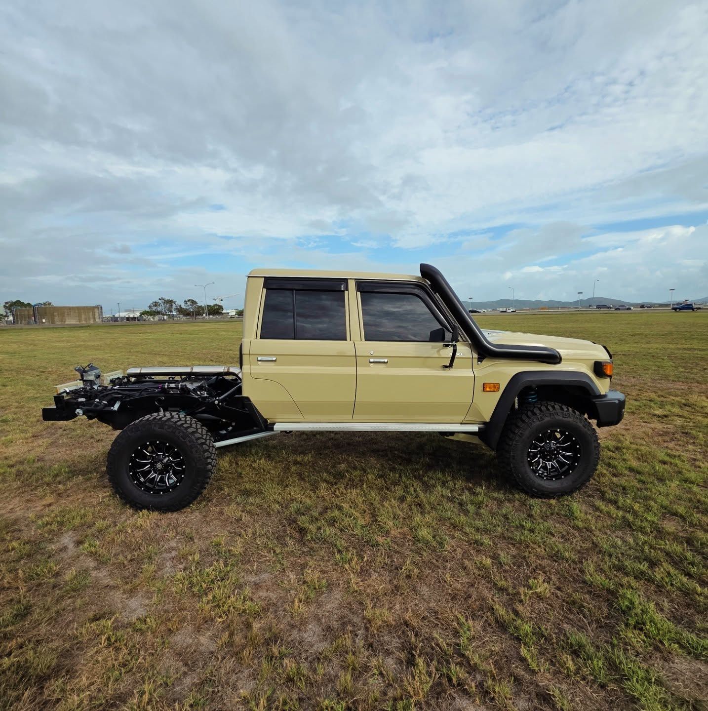 A White Toyota Land Cruiser 70 Series Dual Cab Ute with A Custom Canopy — Ironhide Customs In Garbutt, QLD