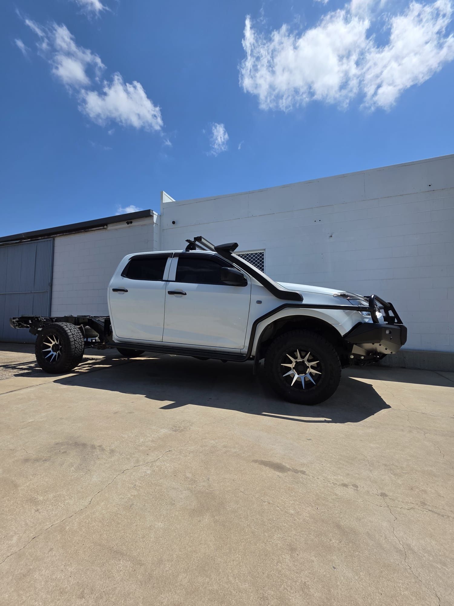 A White, Four-Door Toyota Land Cruiser Utility Vehicle with A Canopy — Ironhide Customs In Garbutt, QLD