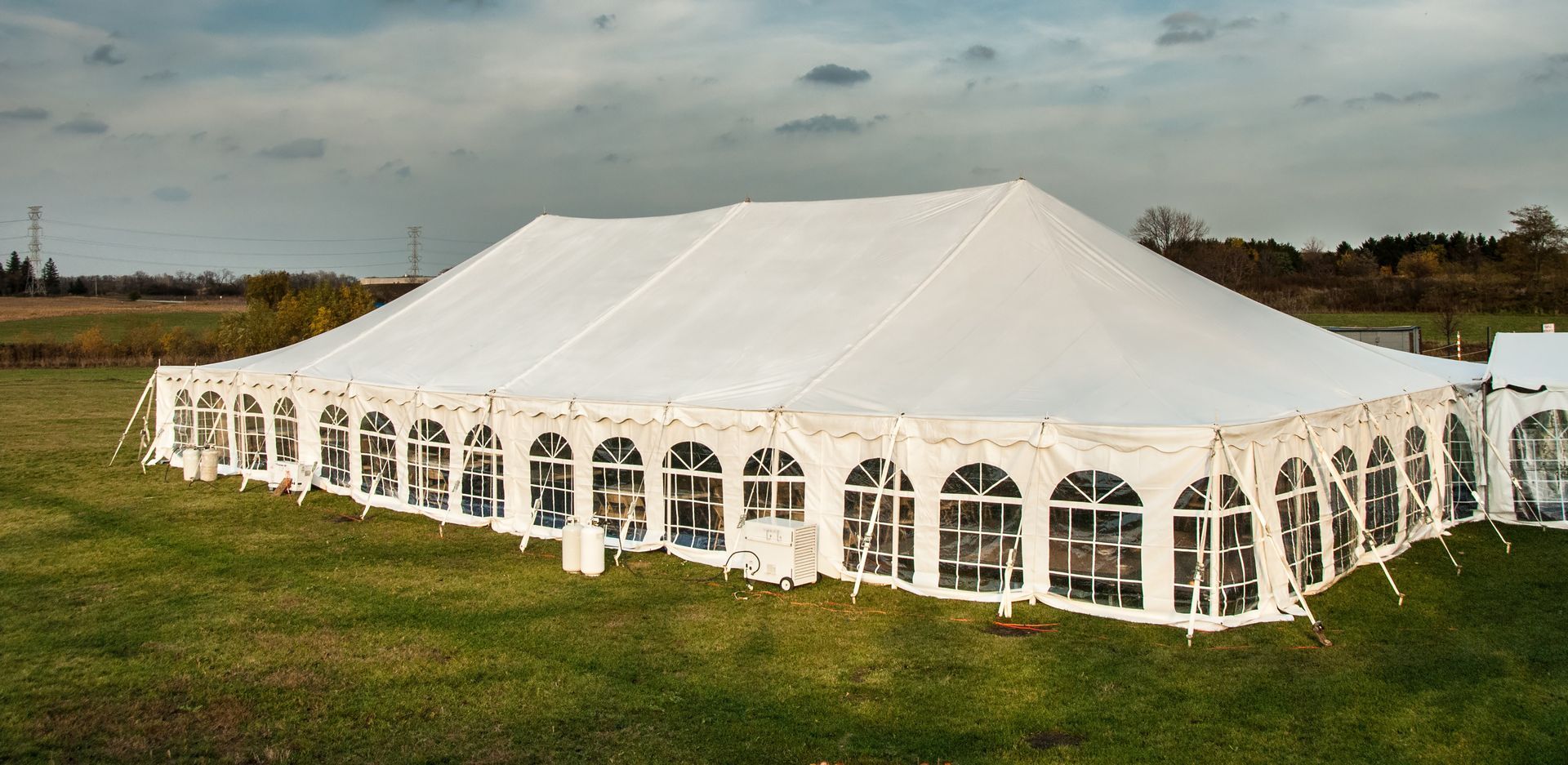 White banquet wedding tent or party tent at twilight time.