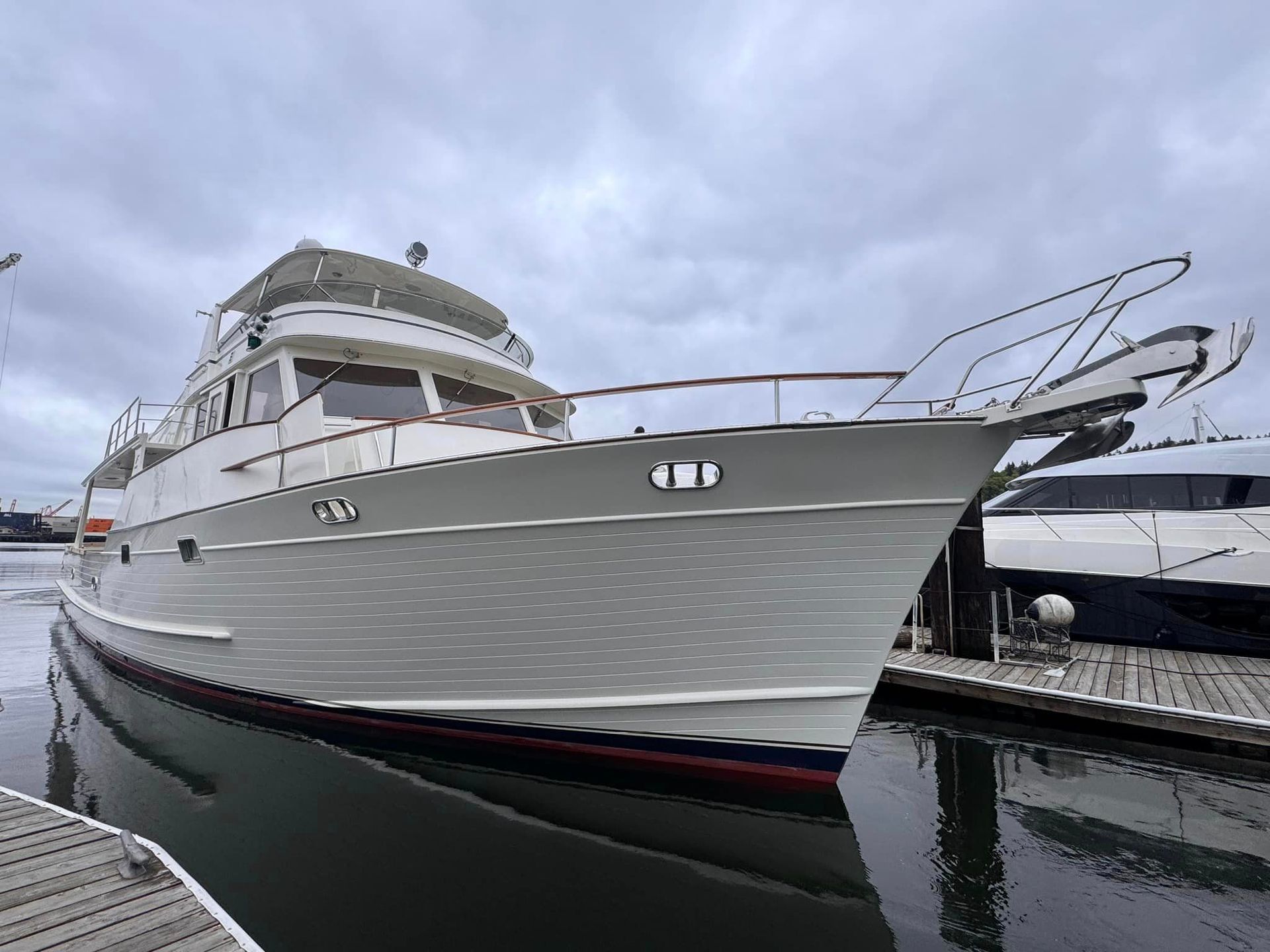 A large yacht is floating on top of a large body of water.