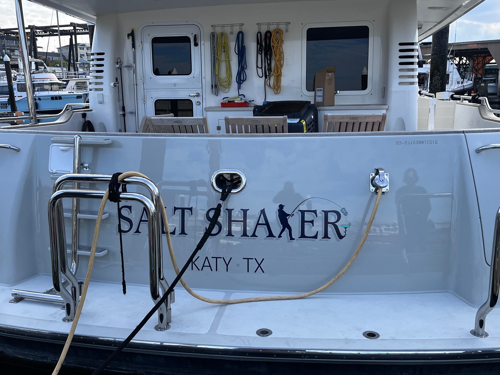 The back of a boat with the name salt shaker on it