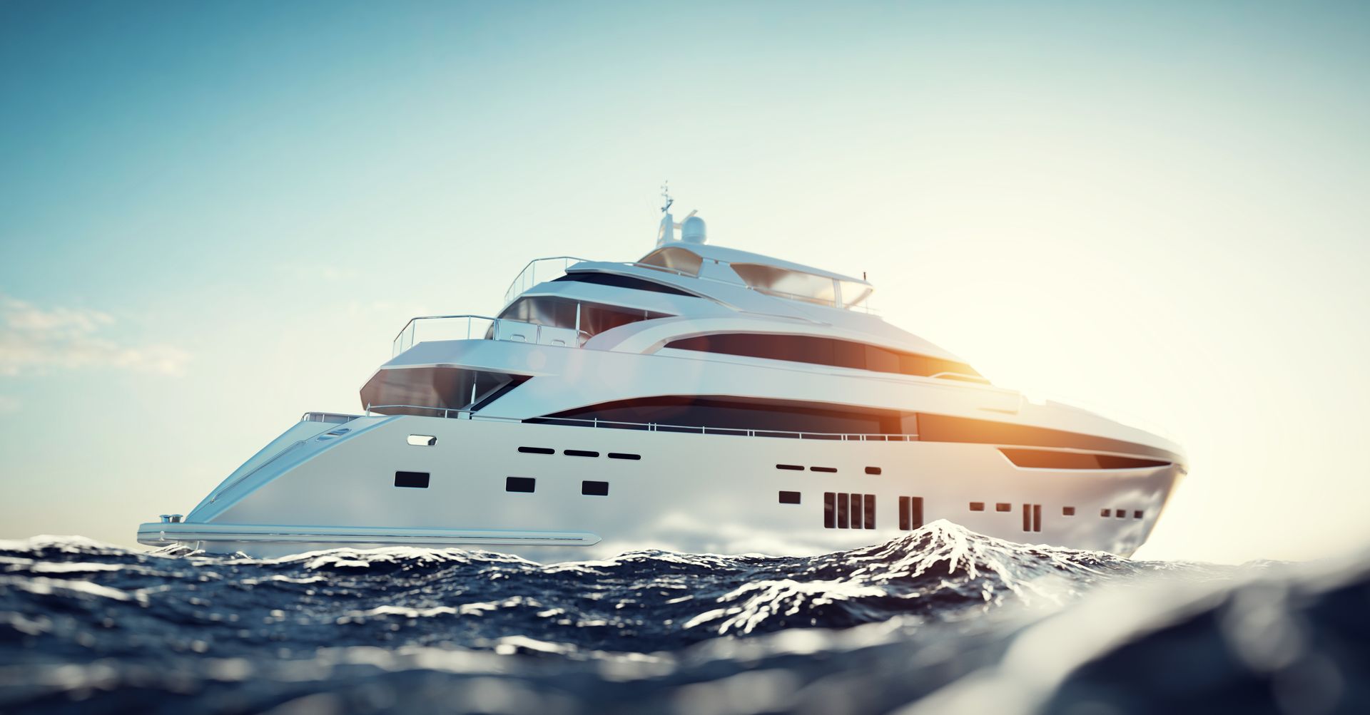 A large yacht is floating on top of a body of water.