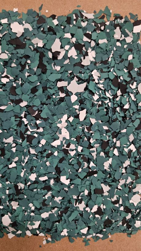Green, black, and white epoxy flakes.