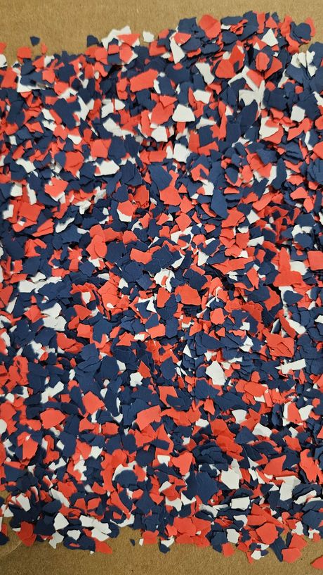 Blue, white, and red decorative floor flakes.